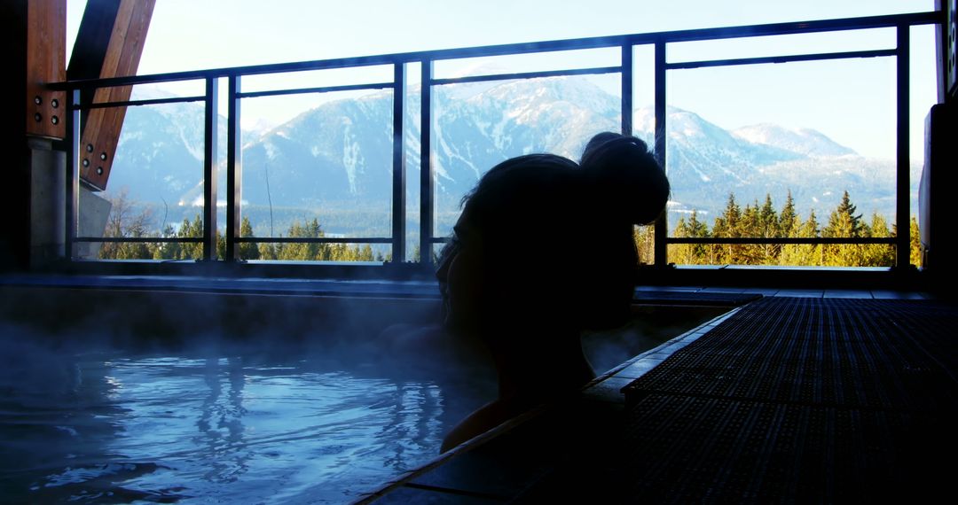 Woman Relaxing in Hot Spring Overlooking Snowy Mountains - Free Images, Stock Photos and Pictures on Pikwizard.com