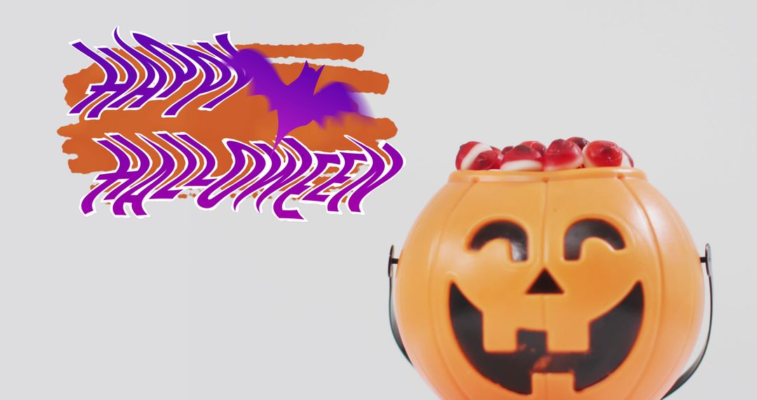 Happy Halloween Text with Pumpkin Bucket and Sweets