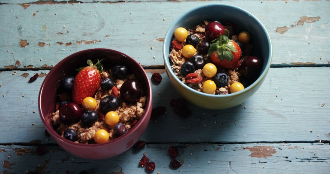 Healthy Granola Breakfast with Assorted Fruits in Bowls - Free Images, Stock Photos and Pictures on Pikwizard.com