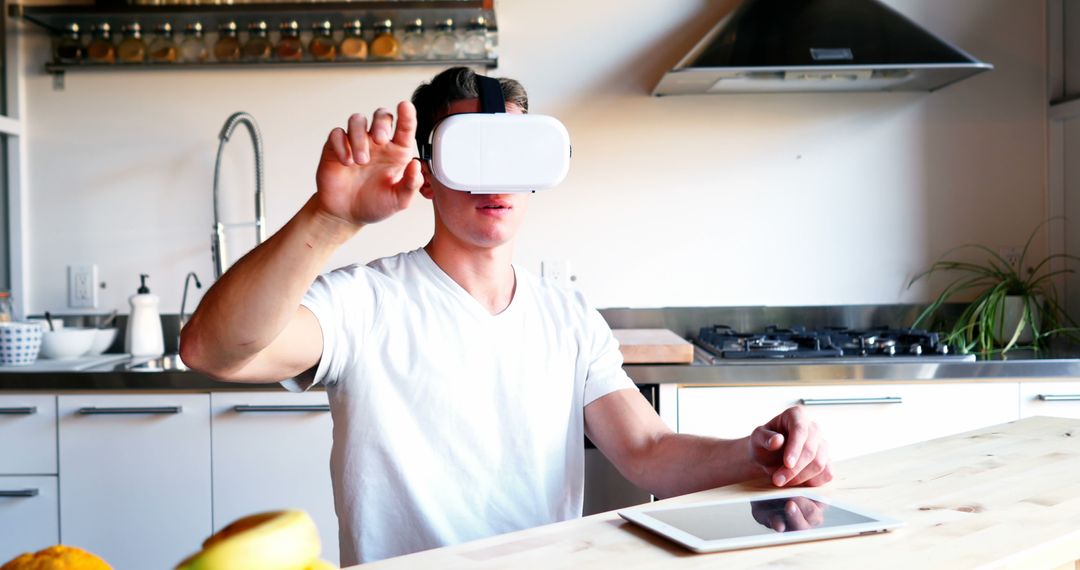 Man Experiencing Virtual Reality in Modern Kitchen - Free Images, Stock Photos and Pictures on Pikwizard.com