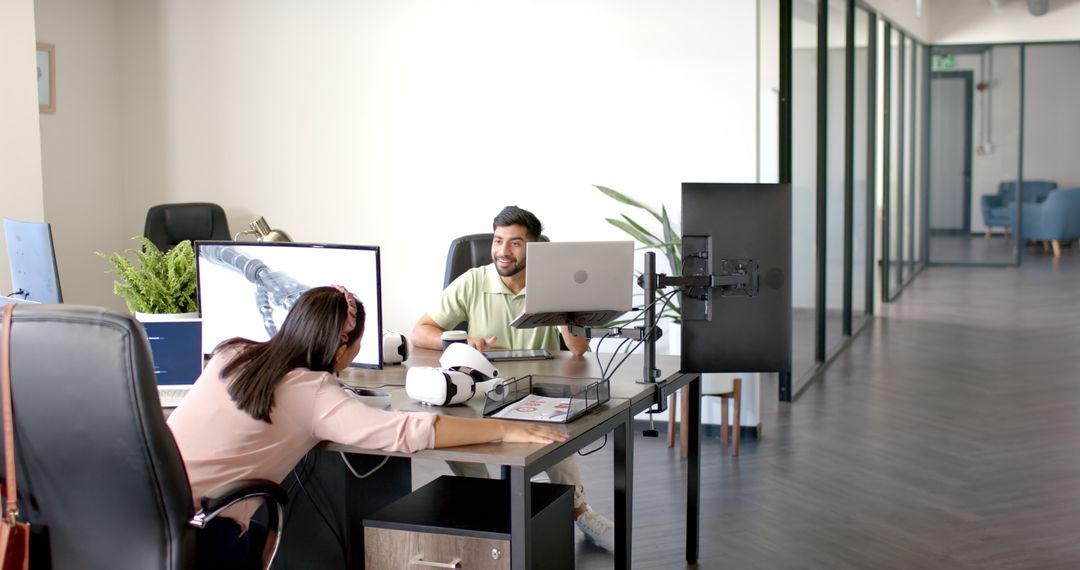 Coworkers Discussing Robotics Design in Modern Office