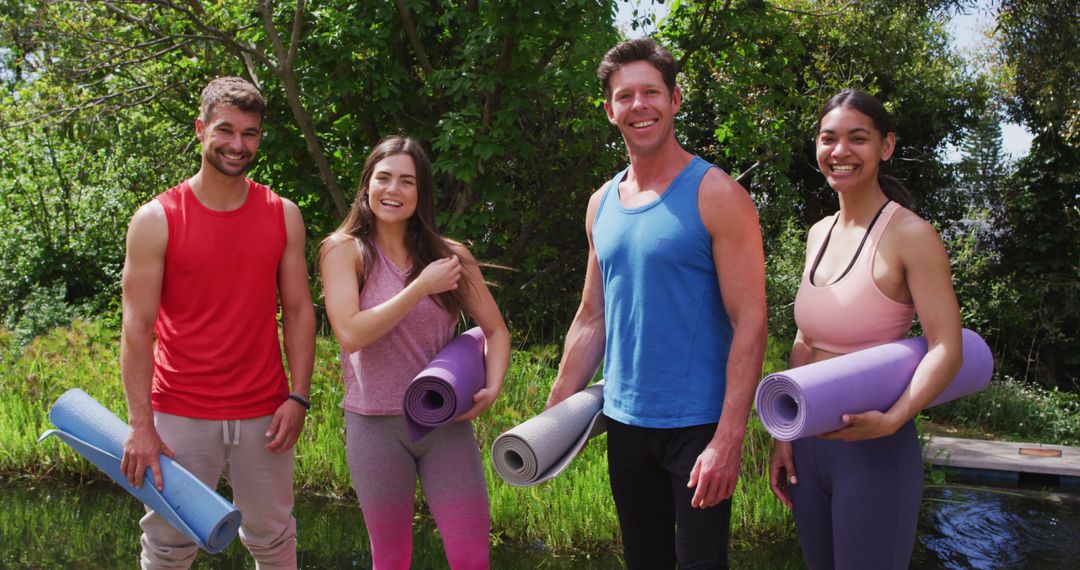 Diverse Group Smiling with Yoga Mats in Nature
