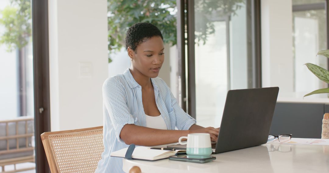 Focused African American Woman Working on Laptop at Home Office - Free Images, Stock Photos and Pictures on Pikwizard.com