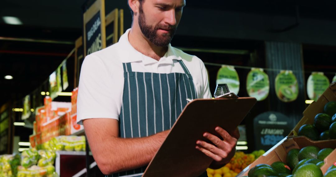 Grocery Store Employee Checking Inventory with Clipboard - Free Images, Stock Photos and Pictures on Pikwizard.com