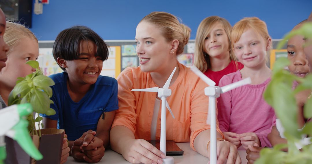 Diverse Classroom Learning About Renewable Energy with Teacher and Wind Turbines