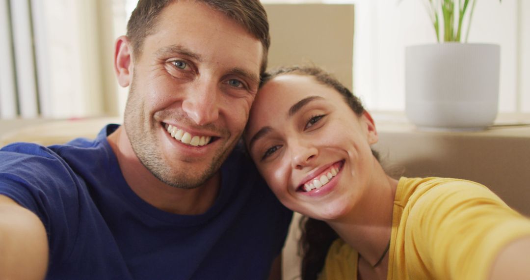 Happy Couple Relaxing Together Taking Selfie at Home