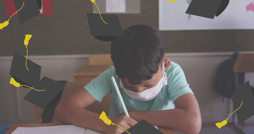 Child Wearing Face Mask Writing in Classroom with Graduating Caps