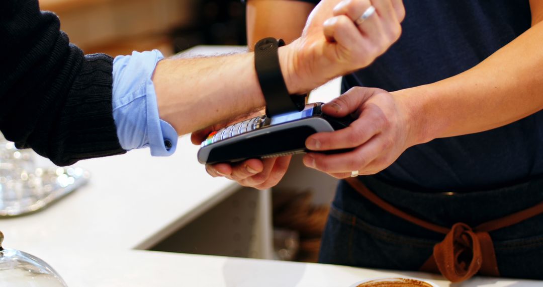 Contactless Payment with Smartwatch at Coffee Shop Counter - Free Images, Stock Photos and Pictures on Pikwizard.com