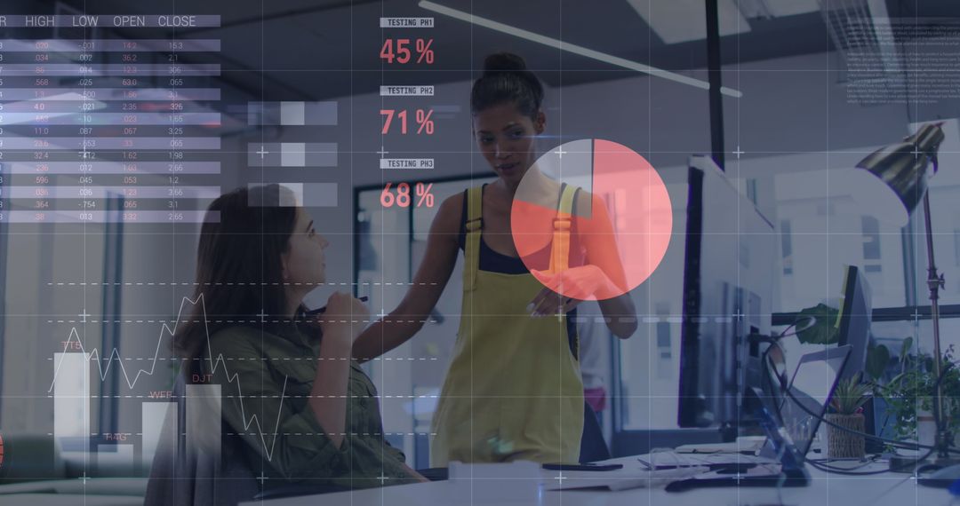 Women Collaborating in Modern Office with Data Visualization Overlay