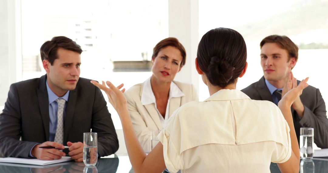 Businesswoman Addressing Colleagues in Conference Room Meeting - Free Images, Stock Photos and Pictures on Pikwizard.com