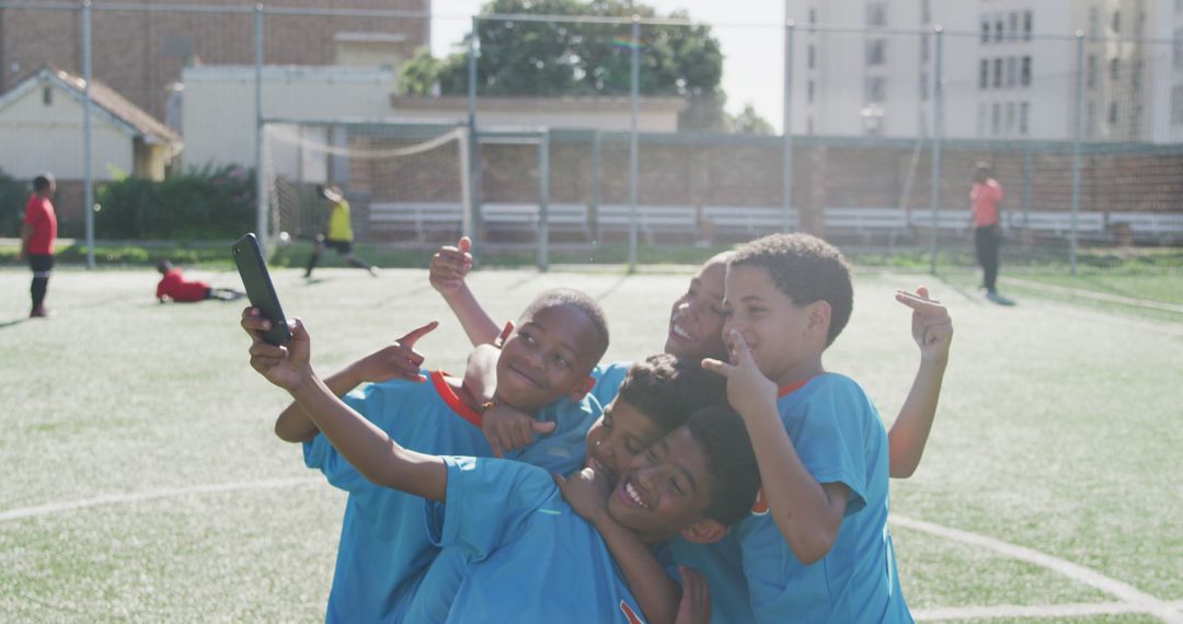 Young Soccer Players Taking Selfie on Field After Match - Free Images, Stock Photos and Pictures on Pikwizard.com