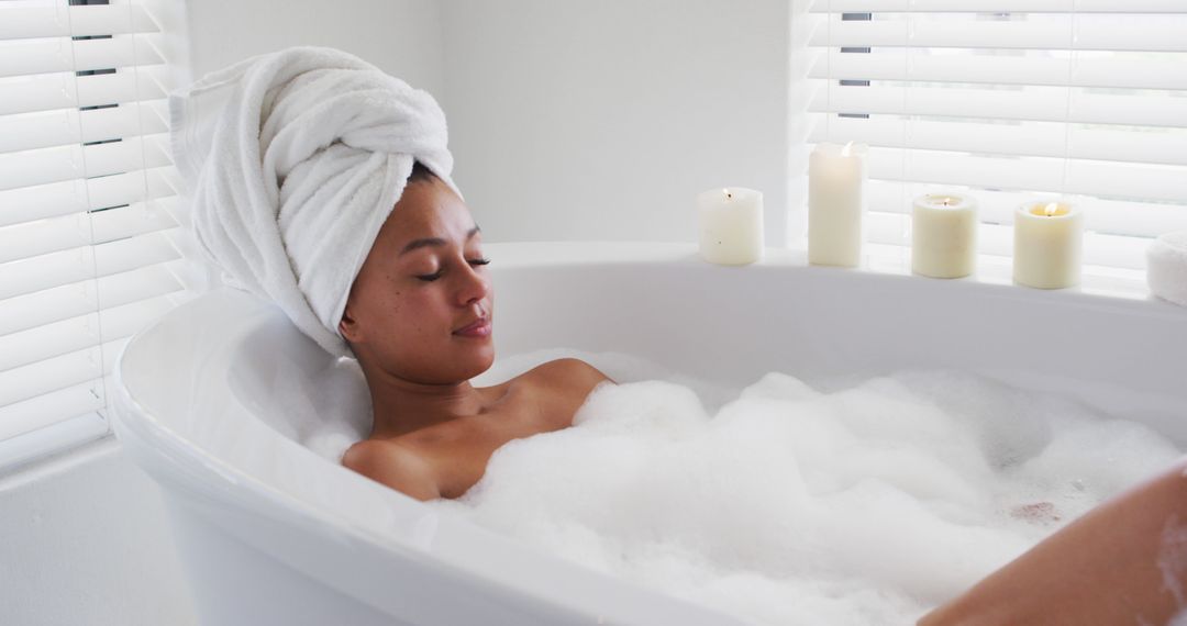 Relaxed Woman Taking Bubble Bath With Candles - Free Images, Stock Photos and Pictures on Pikwizard.com