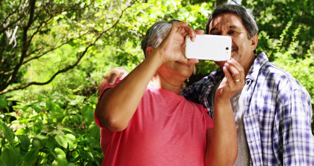 Elderly Couple Taking Selfie In Lush Green Garden - Free Images, Stock Photos and Pictures on Pikwizard.com