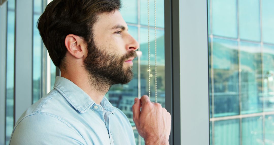Reflective Executive Gazing Out Office Window