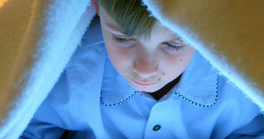 Child Reading Under Blanket with LED Light - Free Images, Stock Photos and Pictures on Pikwizard.com