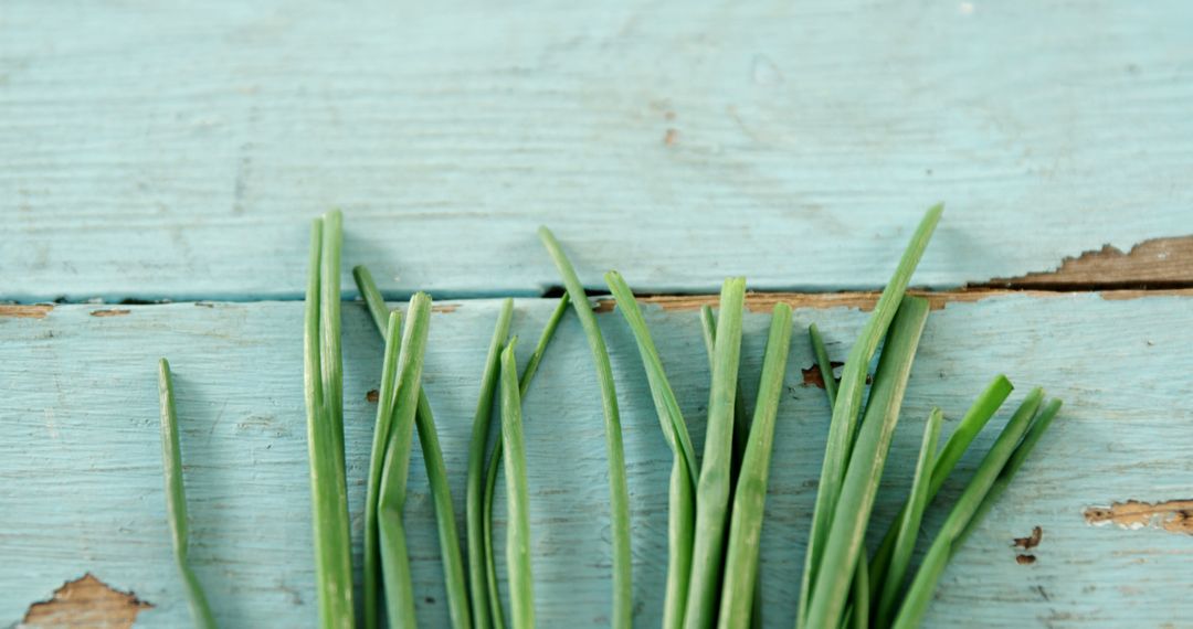 Fresh Green Chives on Rustic Blue Wooden Background - Free Images, Stock Photos and Pictures on Pikwizard.com