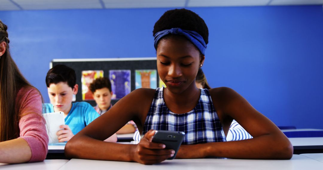 Teenage Girl Using Smartphone in Classroom - Free Images, Stock Photos and Pictures on Pikwizard.com