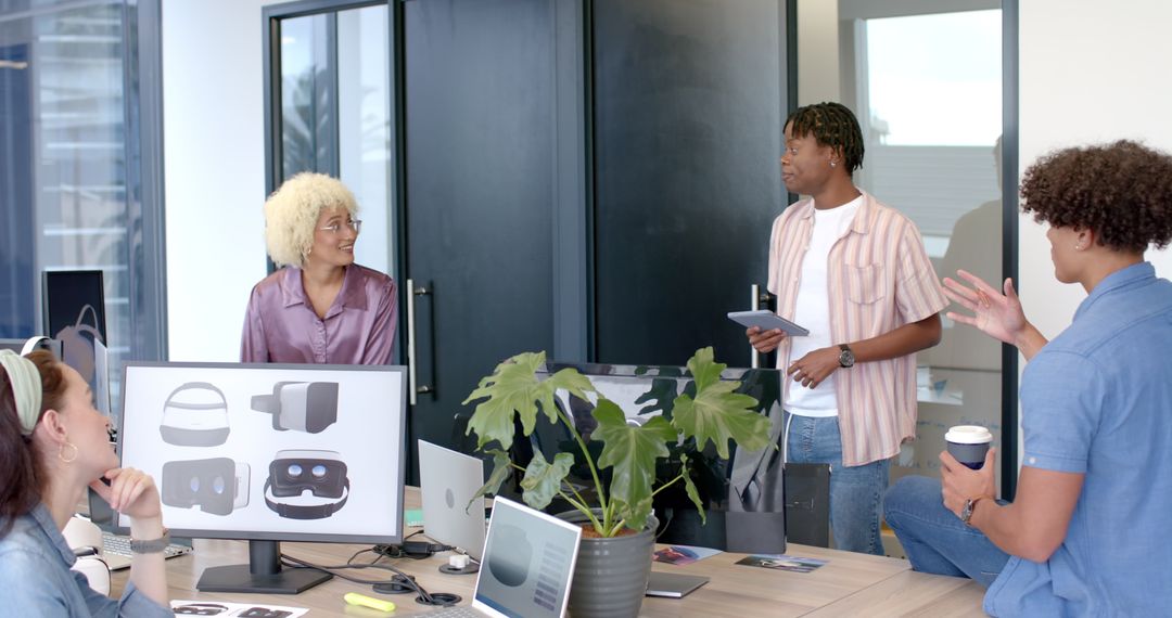 Creative Team Engaged in Discussing VR Designs in Modern Office