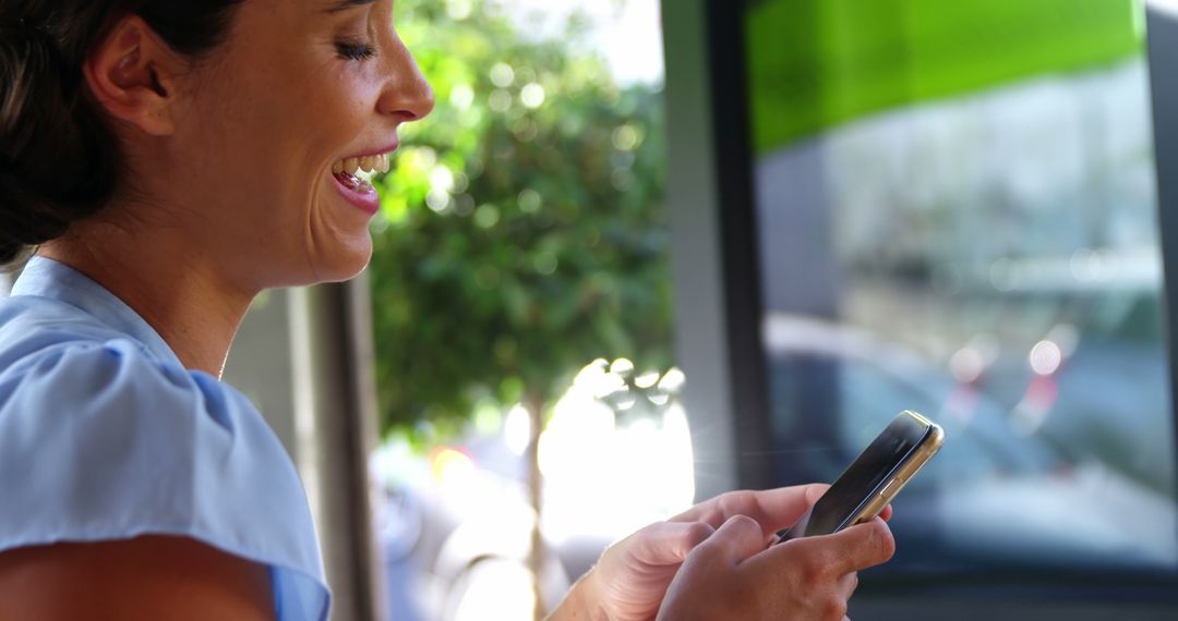 Woman Laughing While Texting Outside - Free Images, Stock Photos and Pictures on Pikwizard.com