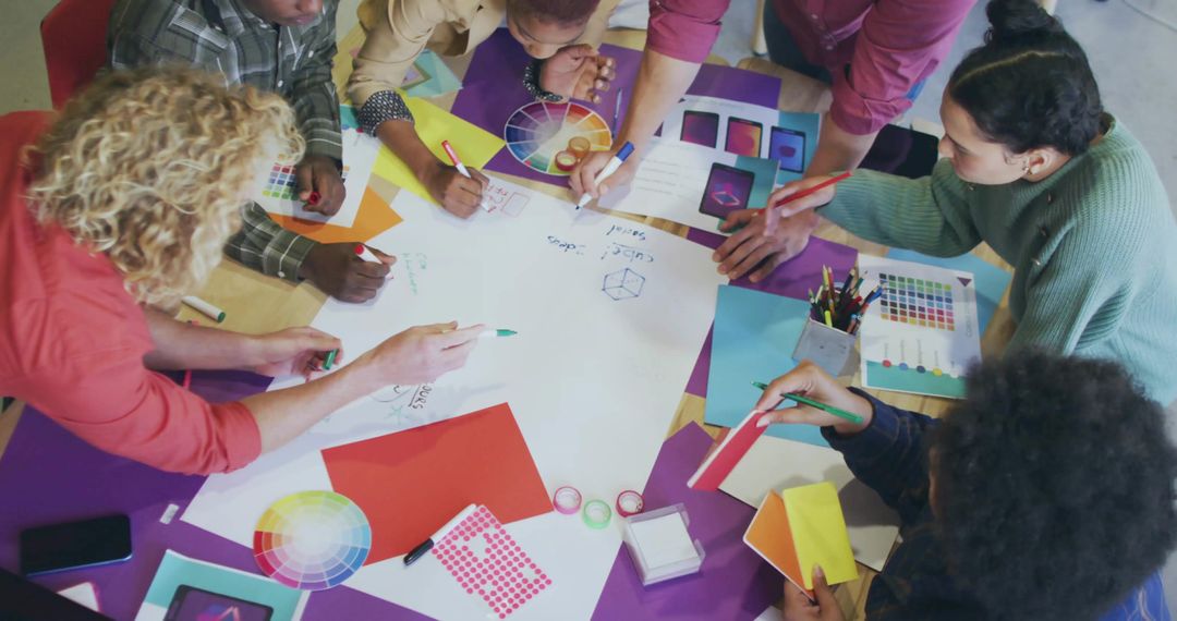 Diverse Creative Team Collaborating on Design Sketches and Color Choices