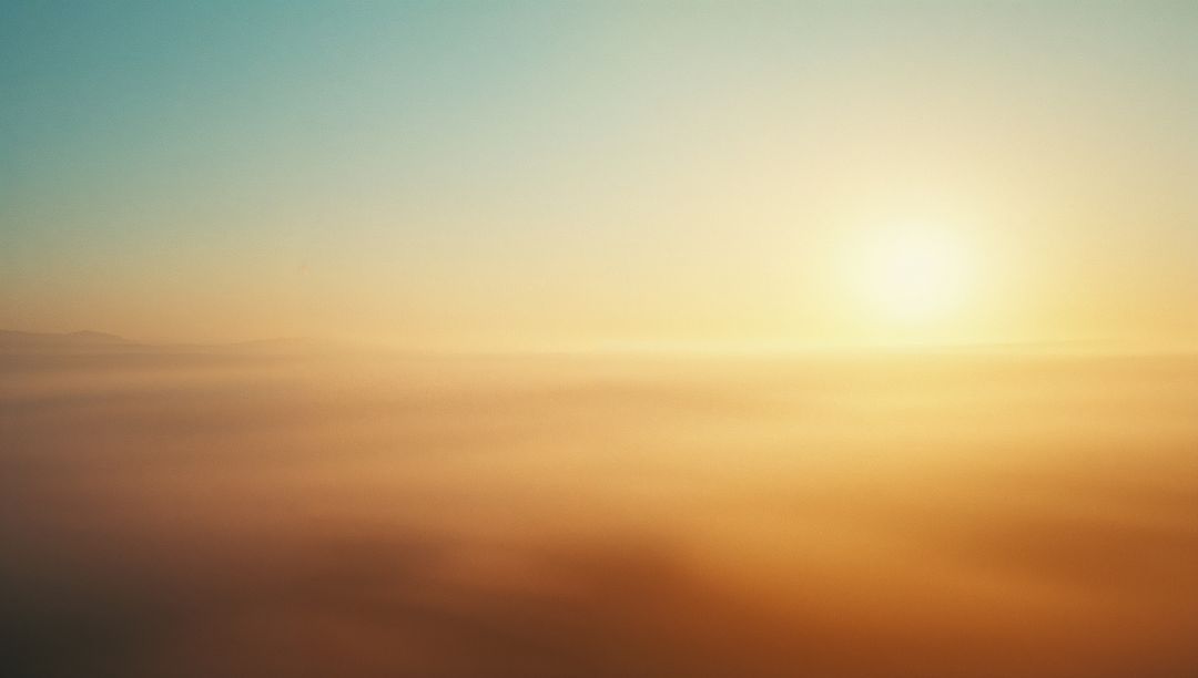 Golden Sunrise Over Misty Clouds at Dawn