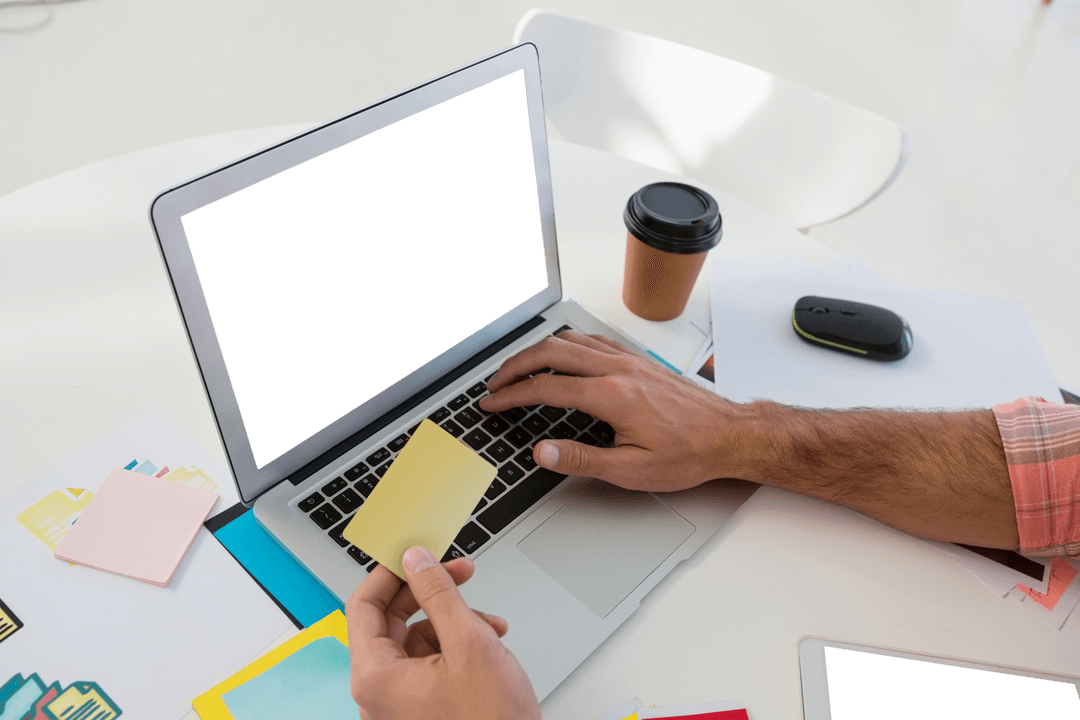Designer Holding Sticky Note with Laptop in Transparent Workspace