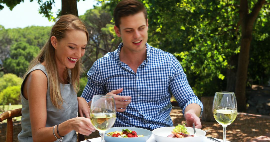 Couple Enjoying Outdoor Lunch at Sunny Patio Cafe - Free Images, Stock Photos and Pictures on Pikwizard.com