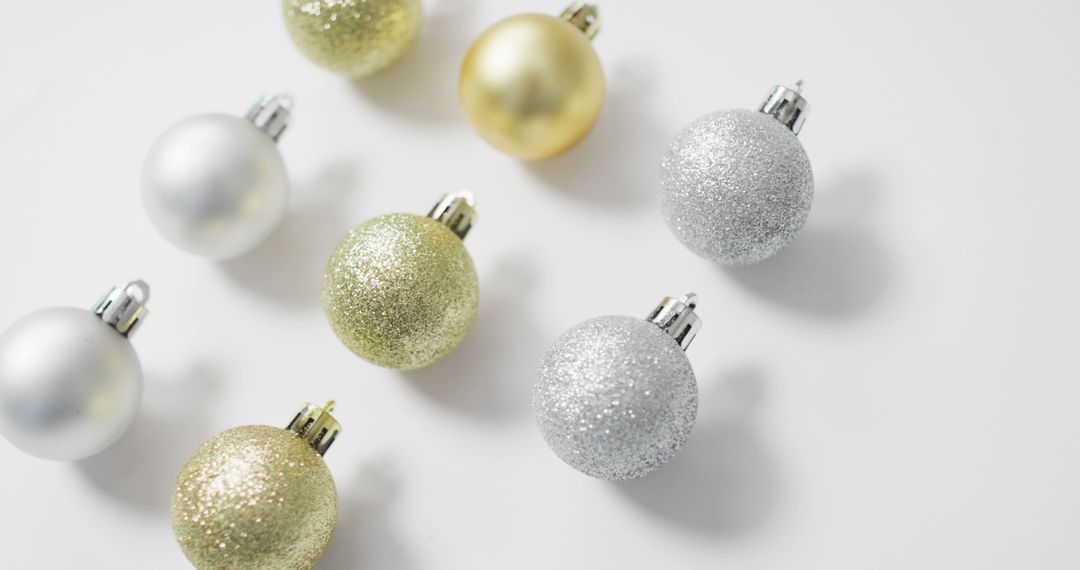 Assorted Metallic Christmas Ornaments on White Background - Free Images, Stock Photos and Pictures on Pikwizard.com