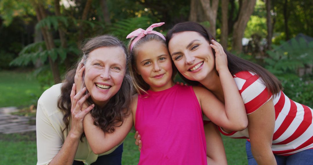 Three Generations of Women Smiling and Embracing Outdoors - Free Images, Stock Photos and Pictures on Pikwizard.com