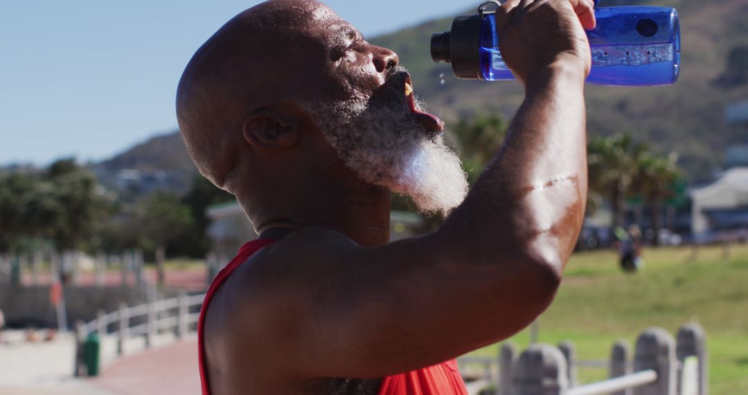 Senior Man Drinking Water During Outdoor Workout - Free Images, Stock Photos and Pictures on Pikwizard.com