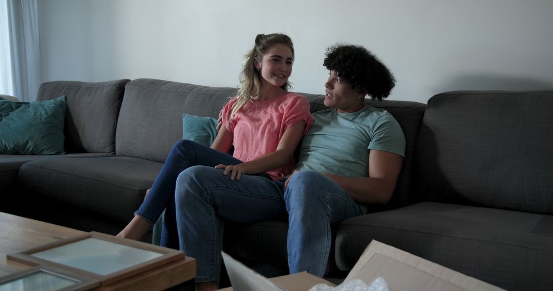 Young Couple Relaxing on Sofa at Home