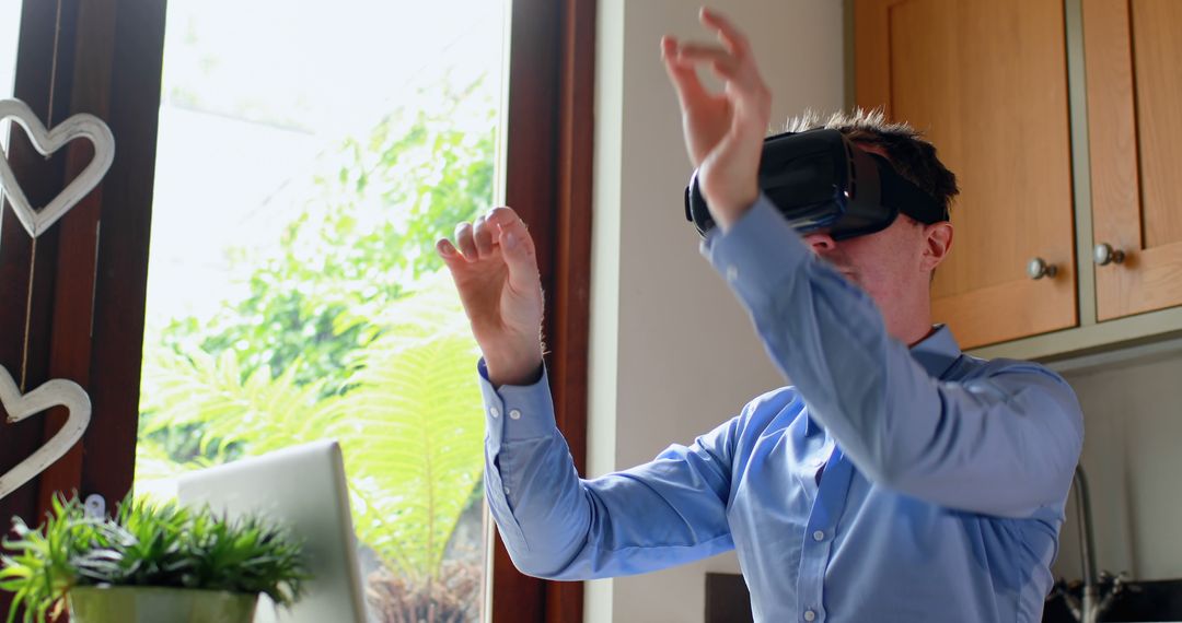 Man Using Virtual Reality Headset in Bright Office Setting - Free Images, Stock Photos and Pictures on Pikwizard.com