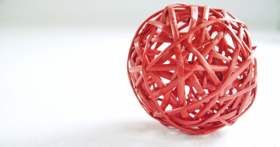 Red Woven Decorative Sphere on White Background - Free Images, Stock Photos and Pictures on Pikwizard.com