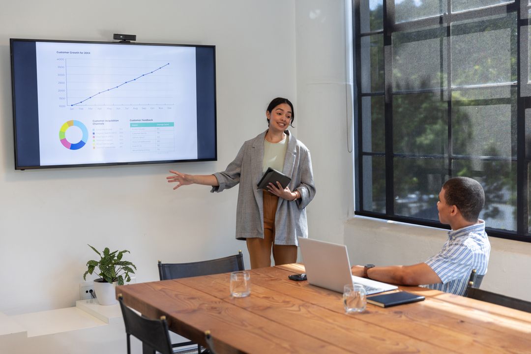 Professionals Analyzing Data During Business Presentation