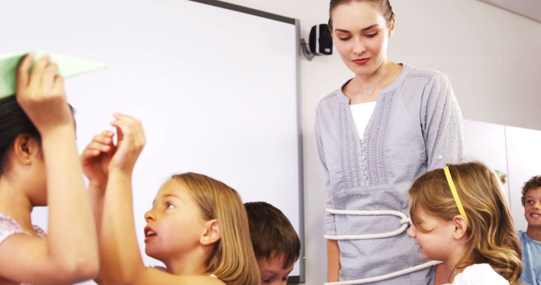 Teacher Leading Classroom Activity with Young Children Interacting - Free Images, Stock Photos and Pictures on Pikwizard.com