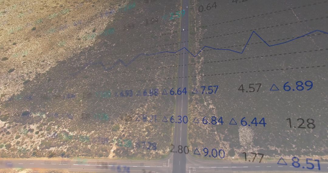 Aerial View of Desert Highway with Financial Data Overlay