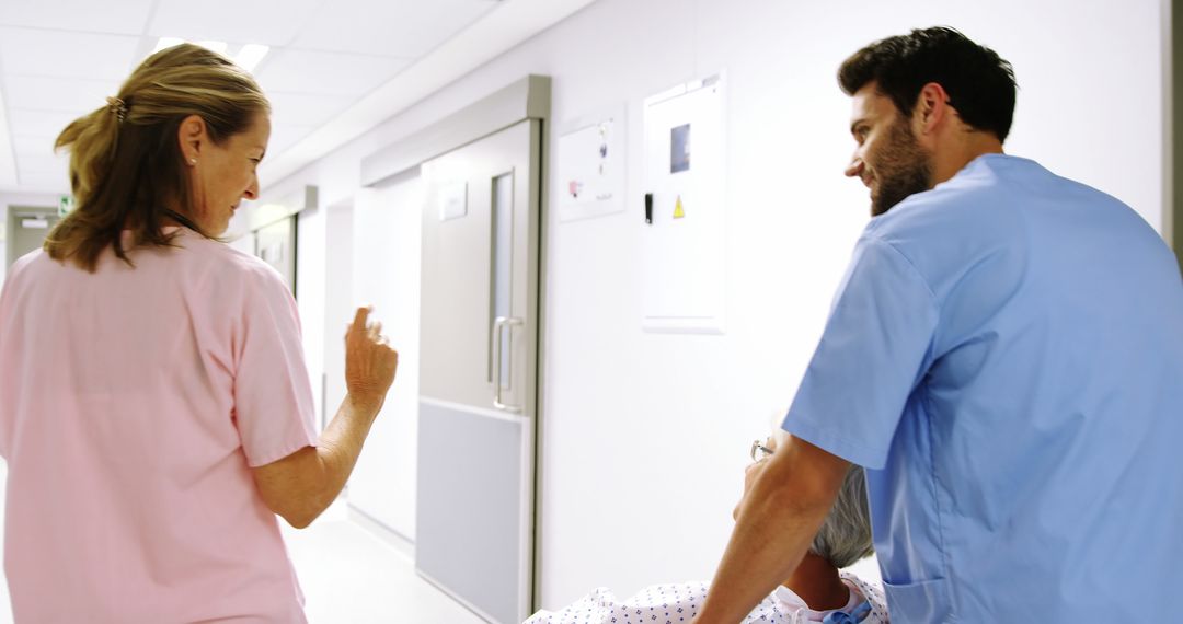 Nurses Assisting Patient in Wheelchair in Hospital Corridor - Free Images, Stock Photos and Pictures on Pikwizard.com