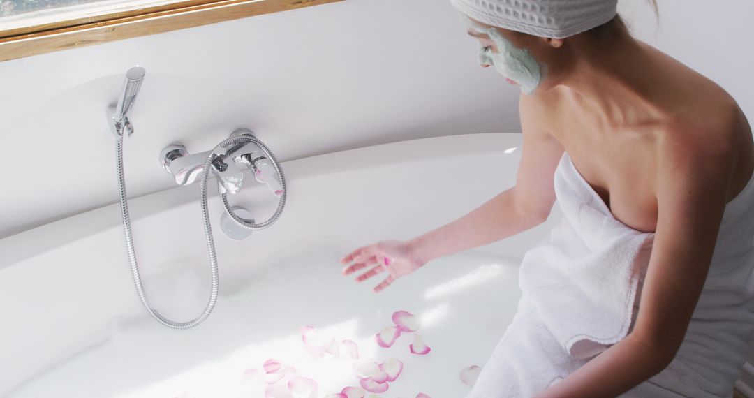 Woman Relaxing in Bathtub with Rose Petals and Face Mask - Free Images, Stock Photos and Pictures on Pikwizard.com