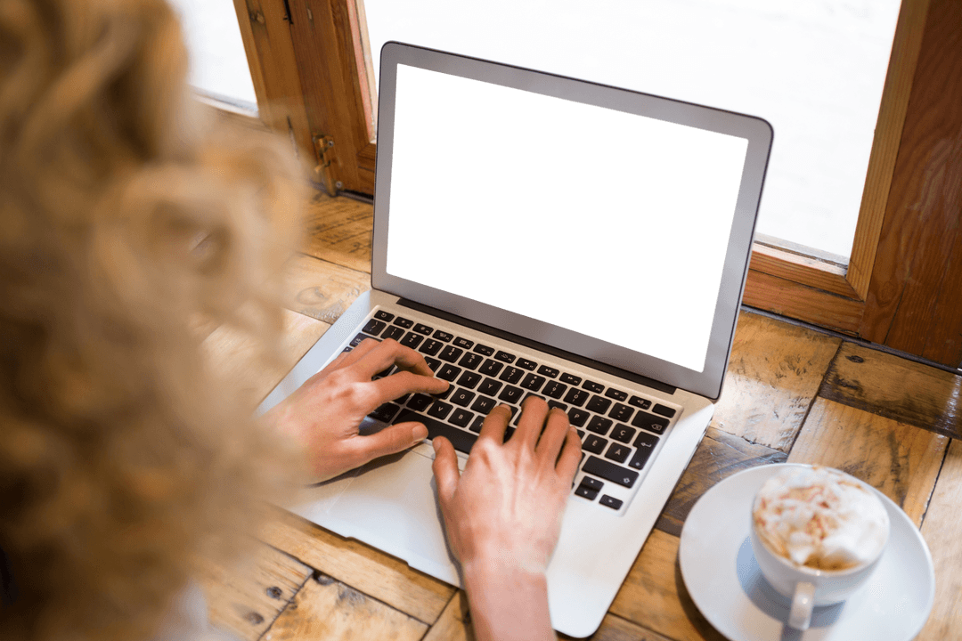 Woman Typing on Laptop at Cafe Enjoying Coffee Transparent