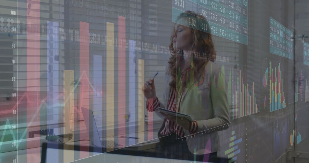 Woman Using Tablet with Digital Charts at Office Desk
