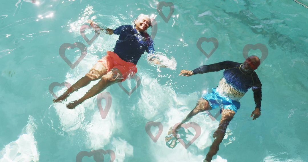 Senior Couple Relaxing Together in Home Pool with Heart Overlays