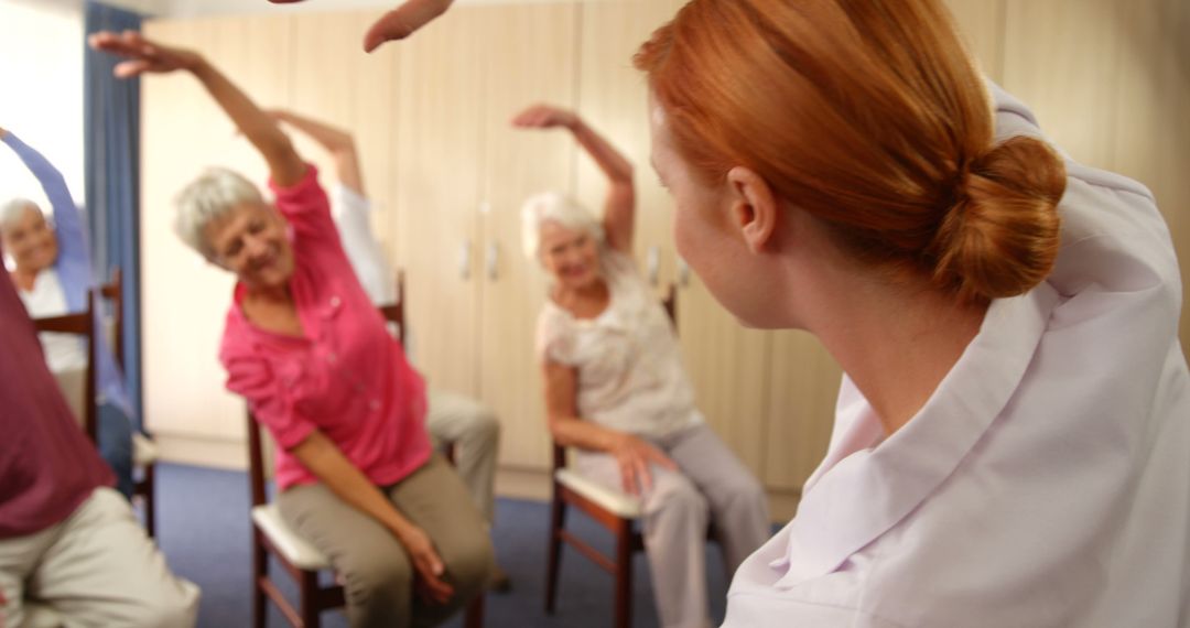 Group of senior women in a fitness class stretching with instructor - Free Images, Stock Photos and Pictures on Pikwizard.com