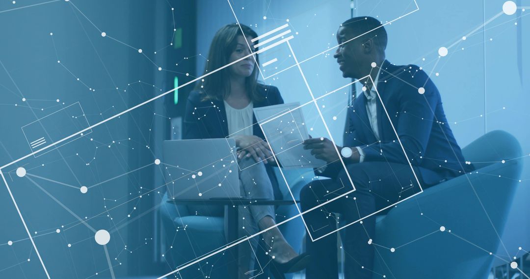 Executives Collaborating in Modern Office Lounge with Digital Network Overlay and Laptop