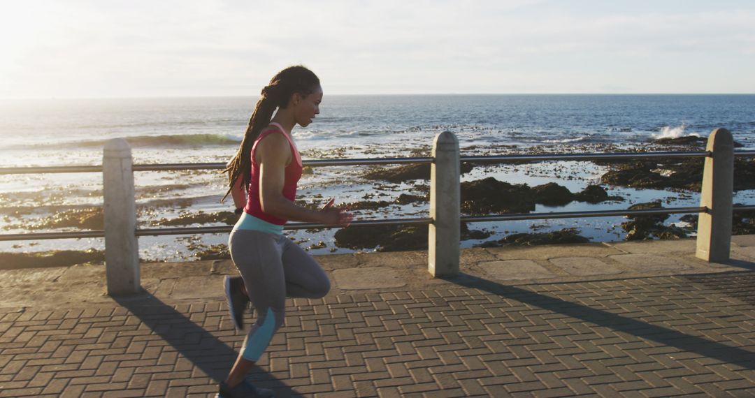 Woman Running Along Seaside Promenade at Sunrise - Free Images, Stock Photos and Pictures on Pikwizard.com