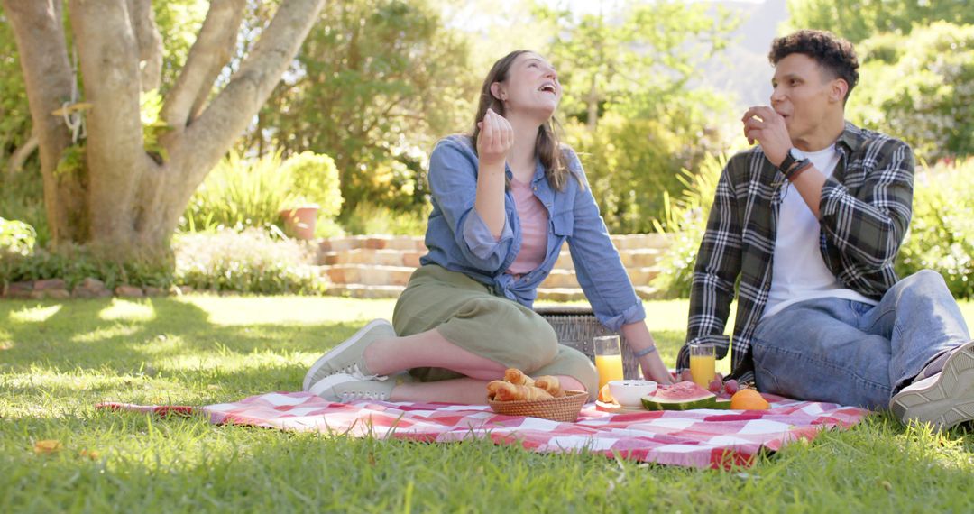 Happy Couple Enjoying Picnic in Sunny Garden