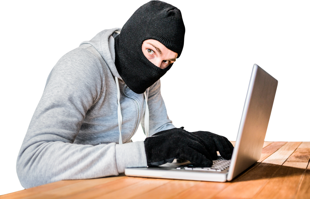 Hacker Wearing Hood Typing on Laptop on Wooden Desk Transparent Background - Download Free Stock Images Pikwizard.com