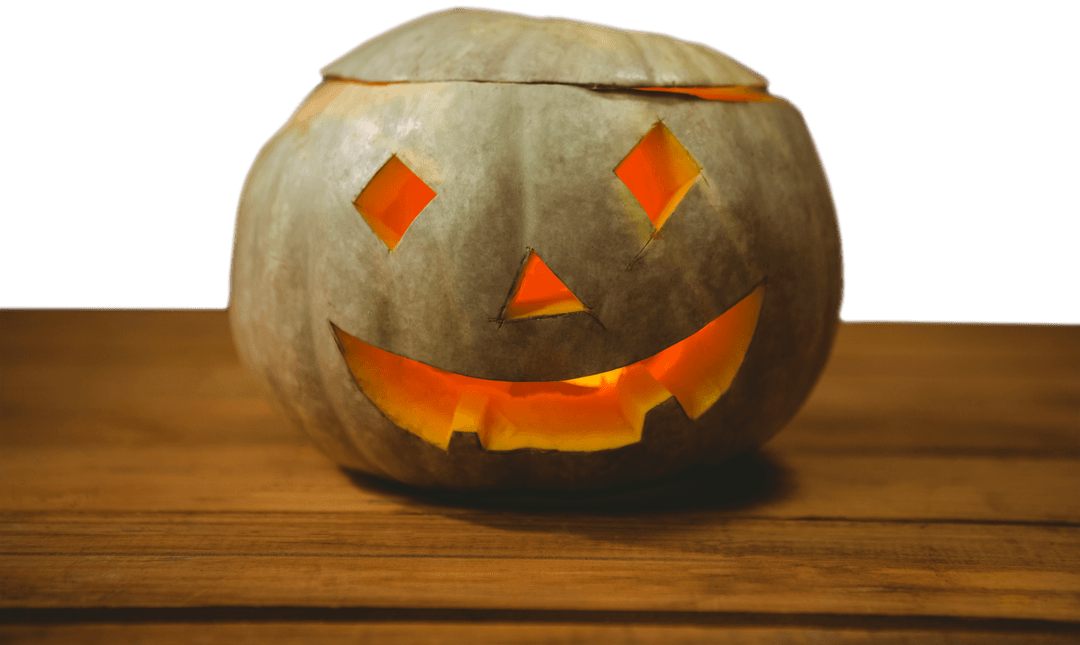 Transparent Jack-o'-Lantern Glows Warmly on Wooden Table