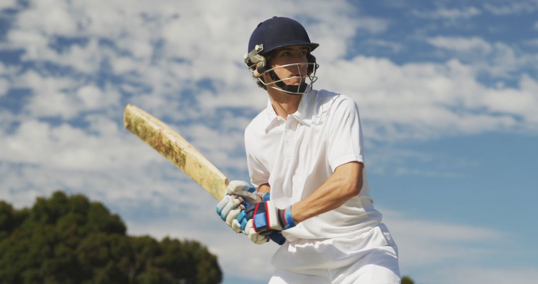 Cricket Player in Action on Sunny Day