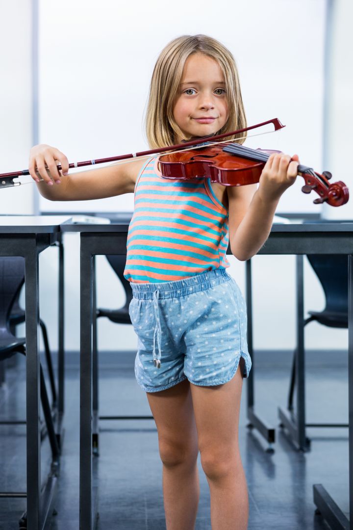 Cute Girl Playing Violin in Classroom - Free Images, Stock Photos and Pictures on Pikwizard.com