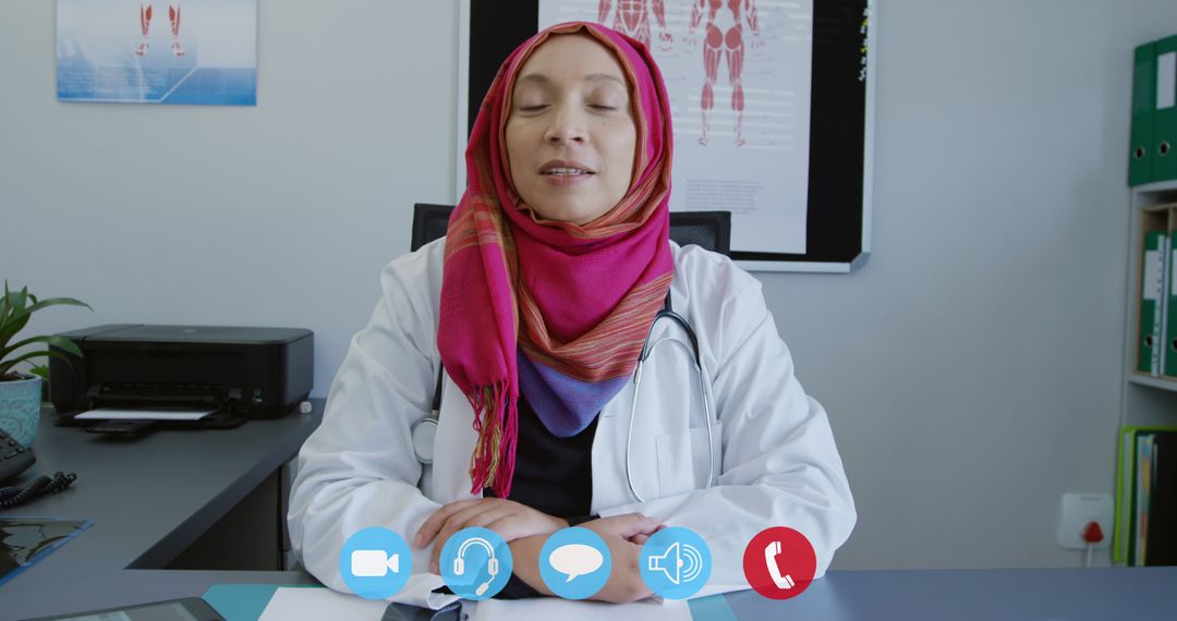 Female Doctor in Hijab Conducting Virtual Consultation via Video Call - Free Images, Stock Photos and Pictures on Pikwizard.com